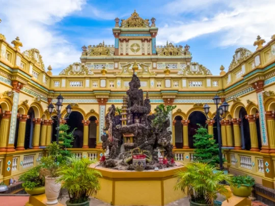 Visiting Vinh Trang Pagoda during Mekong Delta tour from Ho Chi Minh City