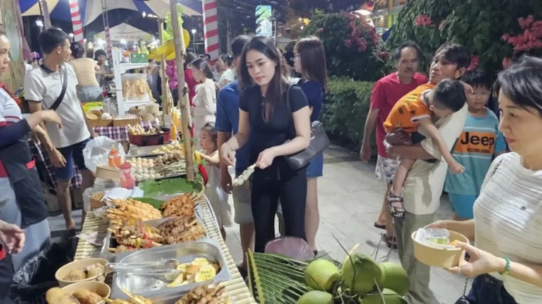Visitors exploring local food stalls in Can Tho