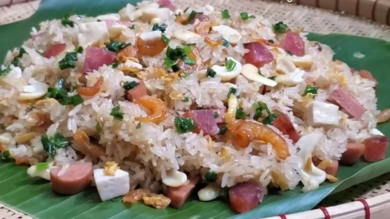 Savory Vietnamese sticky rice topped with meat and sausage